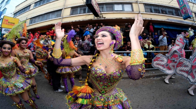 Member of the "Morenada Los Cocanis" group dances during the Carnival parade in Oruro